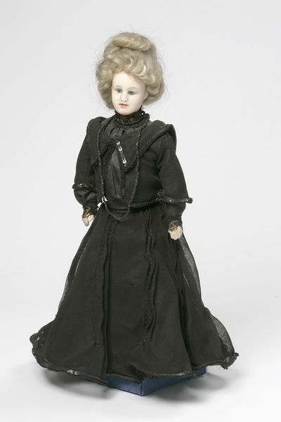 Fair-haired doll dressed in black