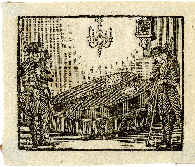 Two funeral mutes watching over two coffins with oval coffin plates on a bier.