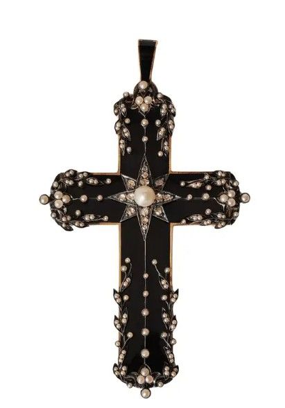 black cross with pearl tendrils on all arms and a diamond star centered around a pearl. 
