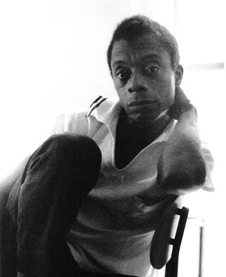 A photo of Baldwin sitting.