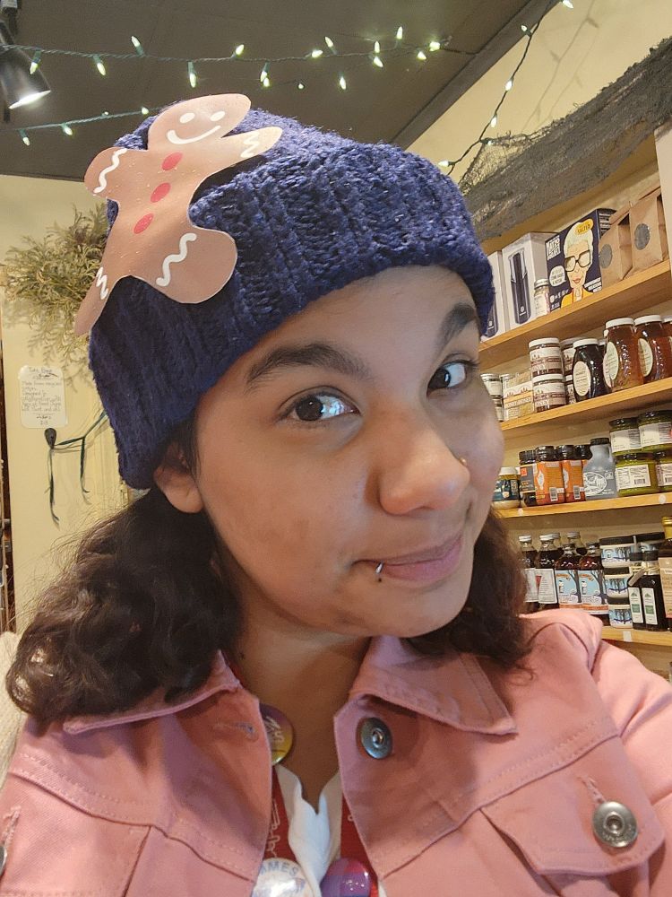 A close up of my beanie with a paper gingerbread man stuck to the side!