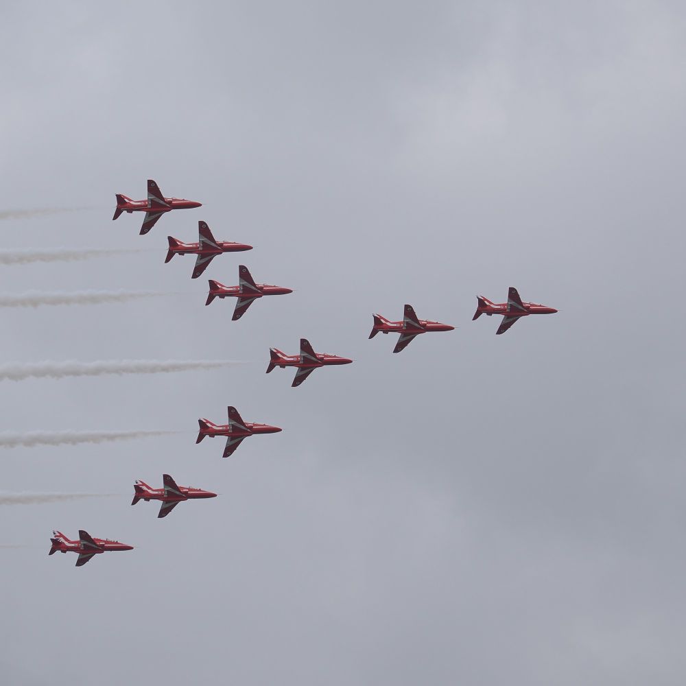 The Red Arrows flying in formation, left to right