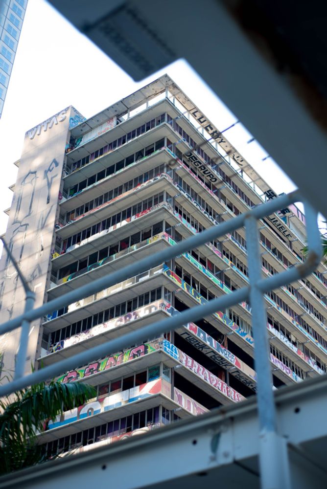 Multiple photos on an abandoned building in Downtown Miami, covered in graffiti.