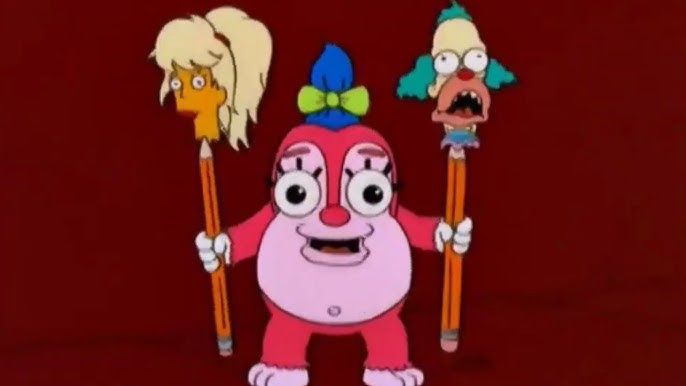 Funzo from The Simpsons, with heads of Malibu Stacy and Krusty the Klown impaled on pencils. 