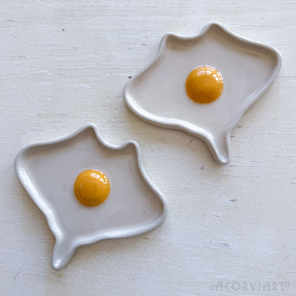 ceramic plates in the shape of egg mantas