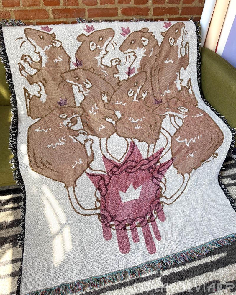 rat king tapestry draped over couch