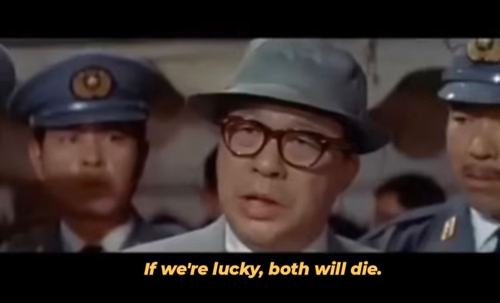 a screenshot from King Kong vs Godzilla (1962) where a Japanese official says 