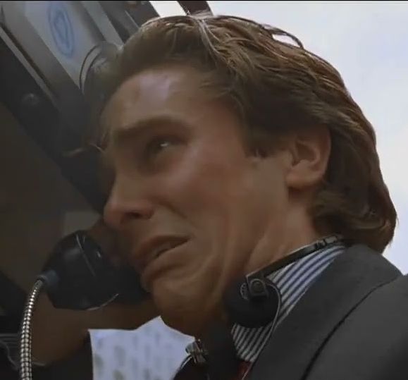 Patrick Bateman crying at a payphone in American Psycho