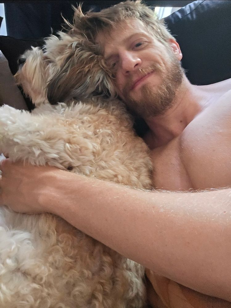 A gay guy with a fat lil dog 