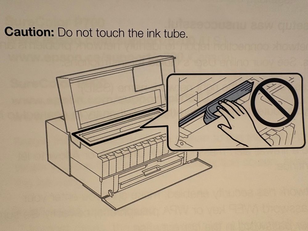 Caution: Do not touch the ink tube.

A line drawing illustrates an inkjet photo printer. A human reaches toward the ink tube and receives an admonishment.
