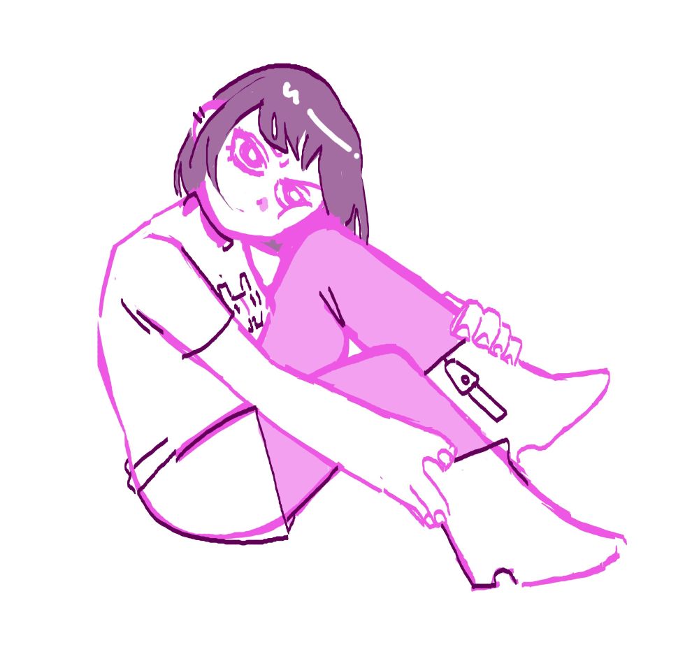 Girl resting her face on her knee and holding her legs with her hands. She appears annoyed.