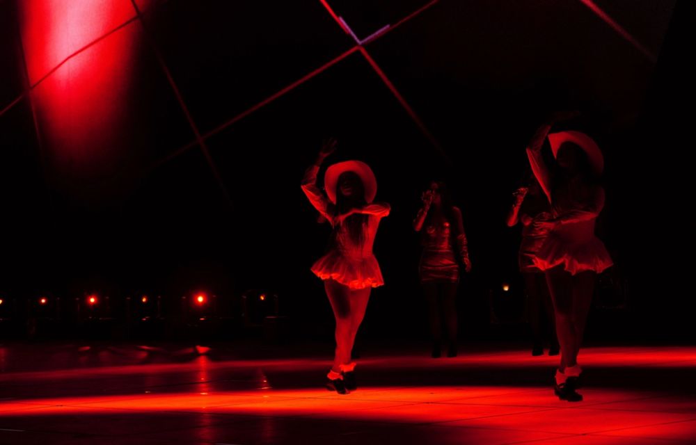 Two black Irish dancers in red light 