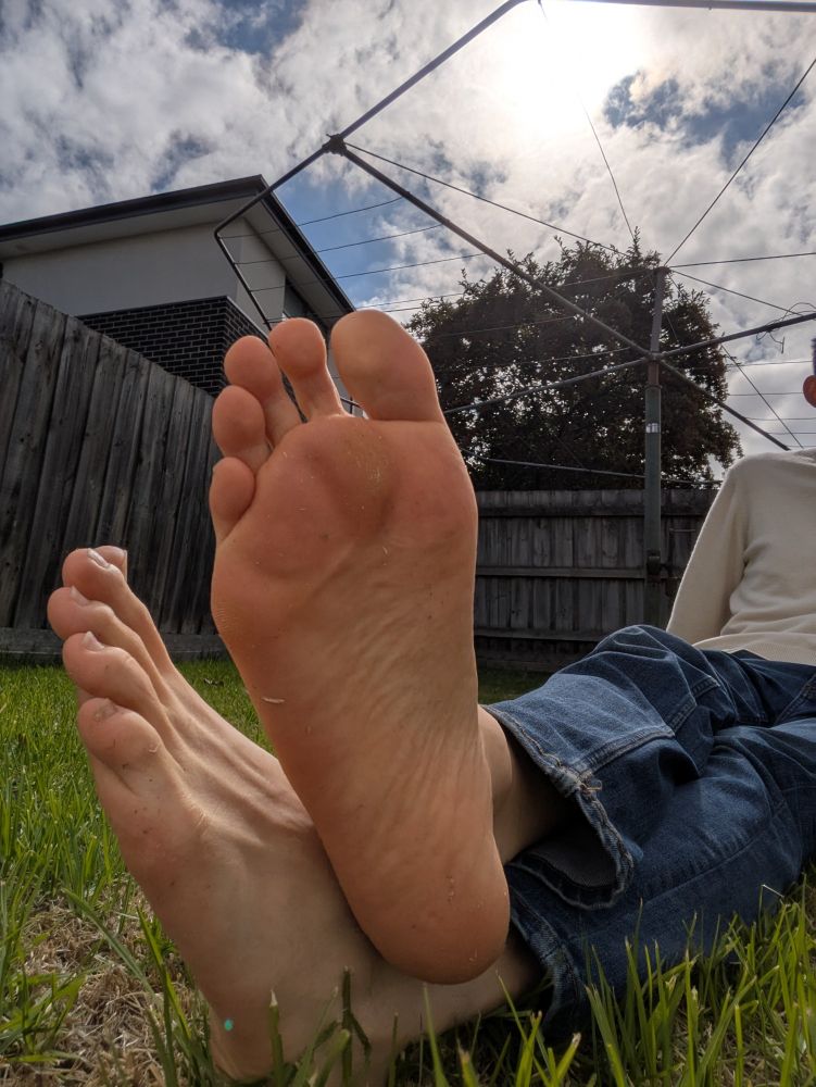 Boy feet on grass