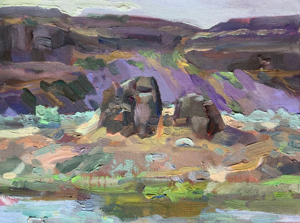 Oil painting with thick paint in places. 2 dominant rock forms in mid ground, cliffs behind and lake in foreground.