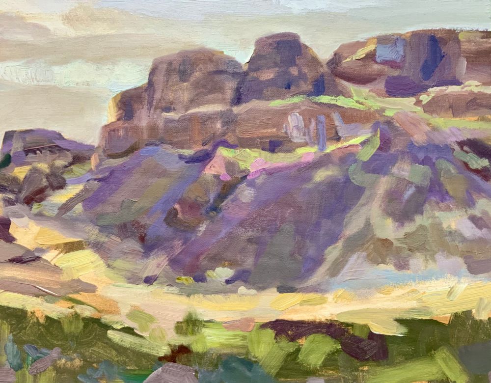 Painting of cliffs. Green in foreground.
Grayish sky . Purple diagonal sloping talus. Yellow curving coulee floor,
Brownish rock .