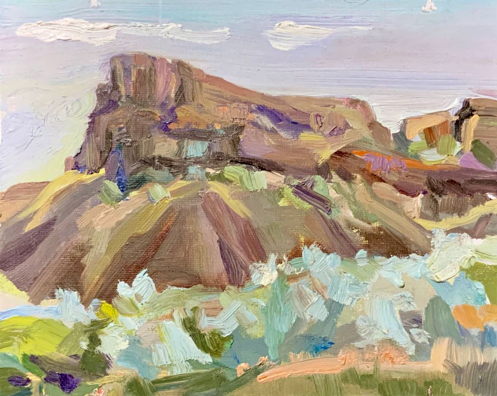 Oil painting of a large rock form surrounded by sagebrush.