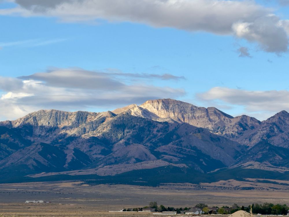 Mountain with morning sunlight hitting the tops. 