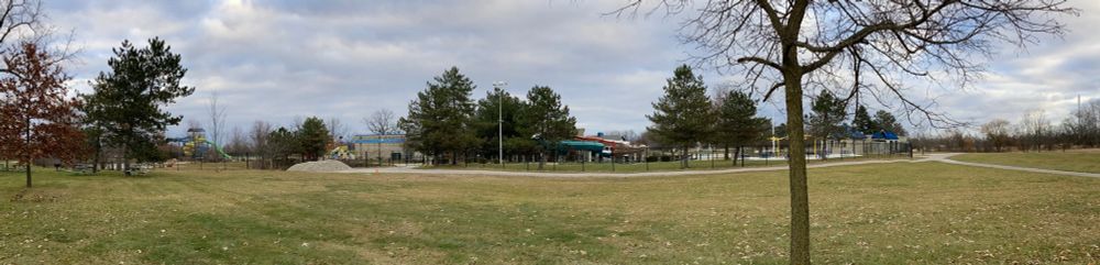 A panoramic photo of a water park reveals that it is closed and empty of water. 