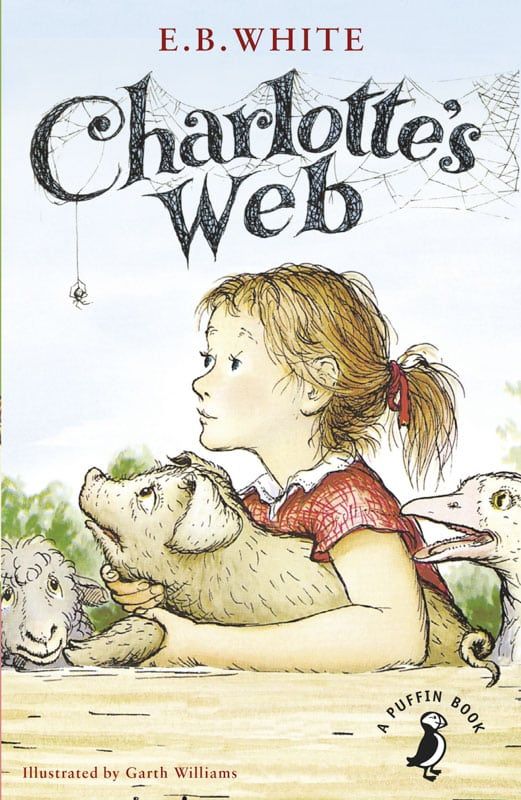 Book cover of Charlotte's Web by E.B. White, illustrated by Garth Williams. Shows a young girl holding a young pig and looking at a spider. Other farm animals in the background.