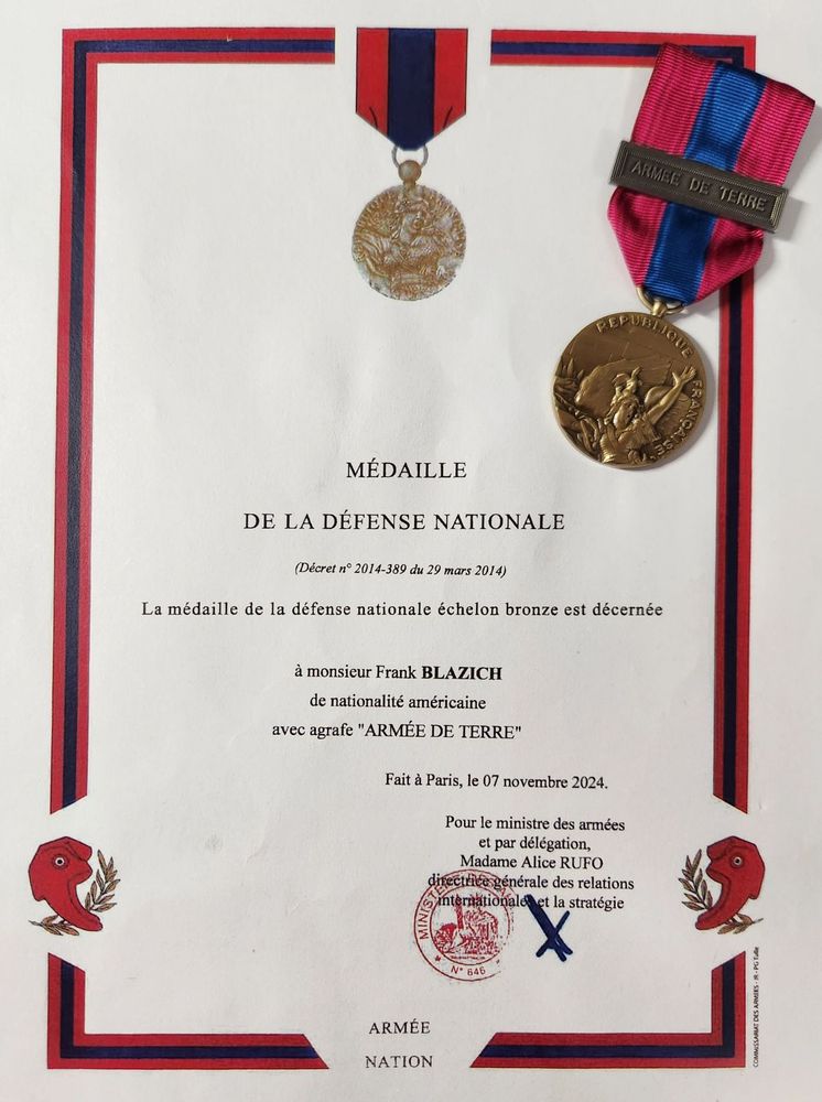 The award certificate and the medal.