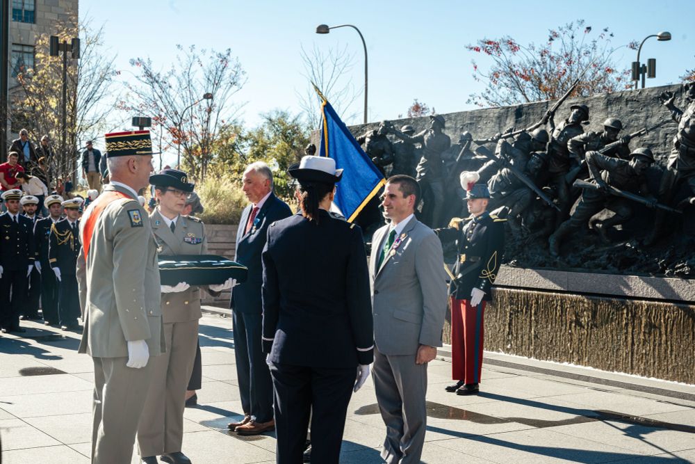 Frank Blazich receiving the medal from French General Francois Lecointre. Other soldiers stand around him.