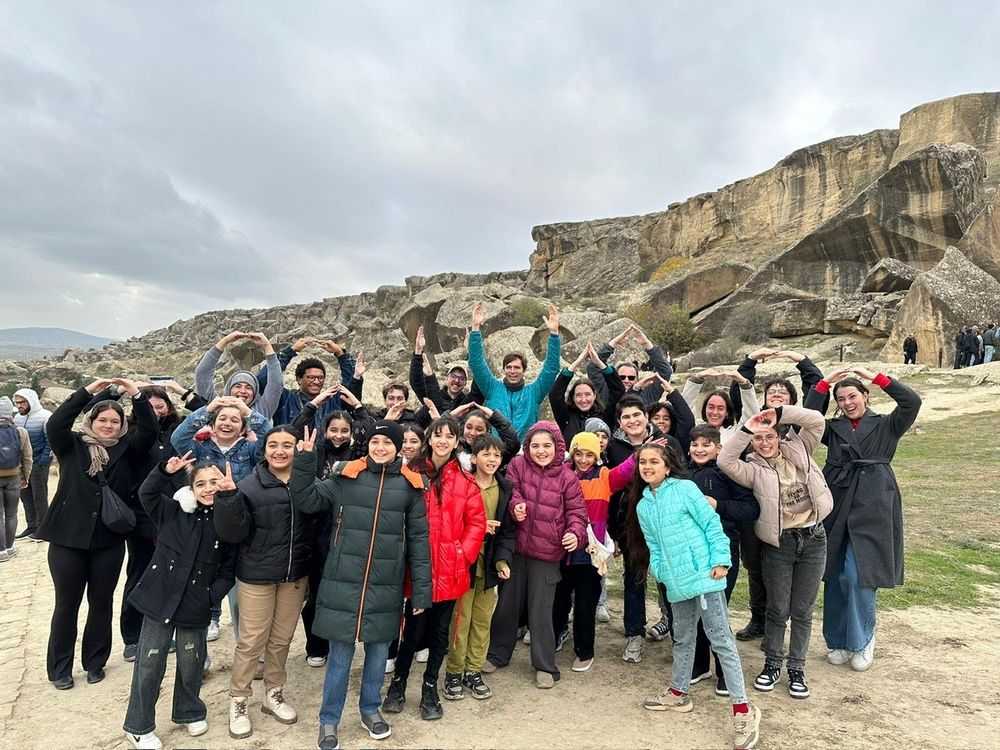 O-H-I-O with local Azerbaijani students at the UNESCO petroglyphs.