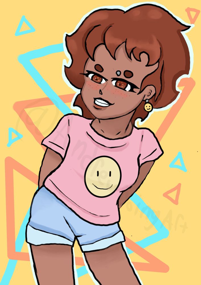 Sherra wearing a pink smiley face shirt and blue shorts. She’s smiling and leaning to the right of the image. She’s also has a smiley face earring. Her hair is shoulder-length and wavy. 