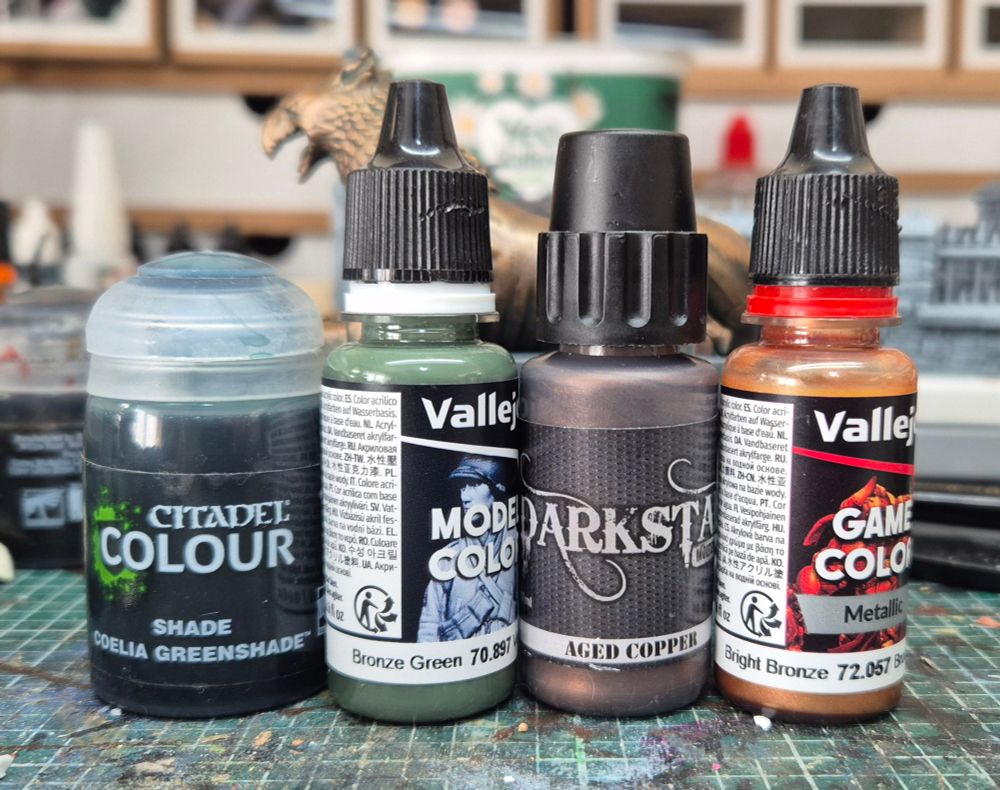4 paints used in the method: Coelia Greenshade, VMC Bronze Green (70.897), Darkstar Aged Copper, VGC Bright Bronze (72.057)