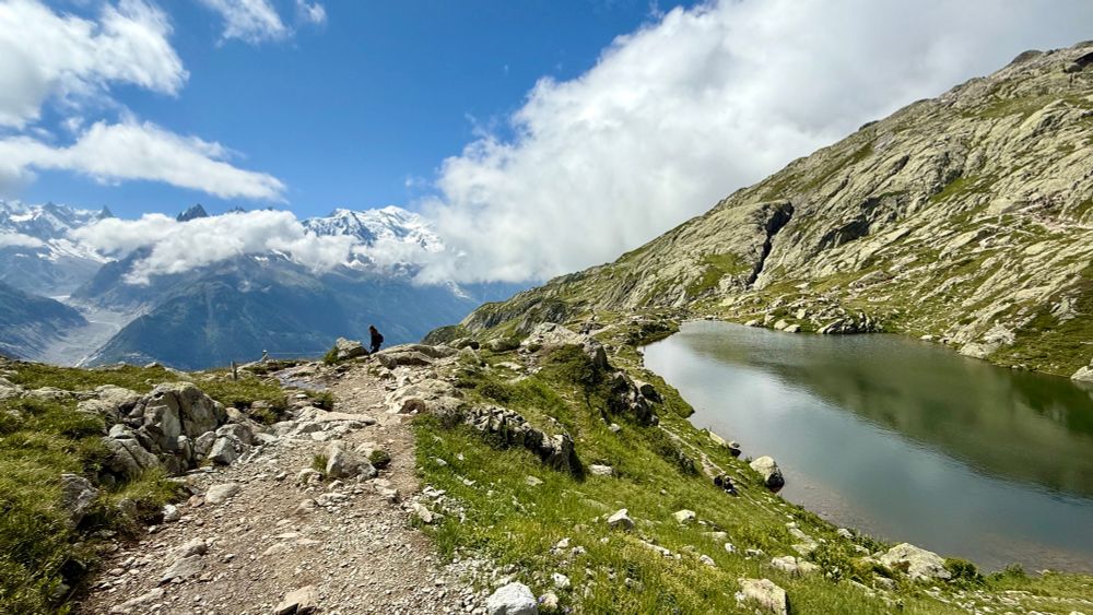 Another view of the Alps with a small lake in the foreground. 