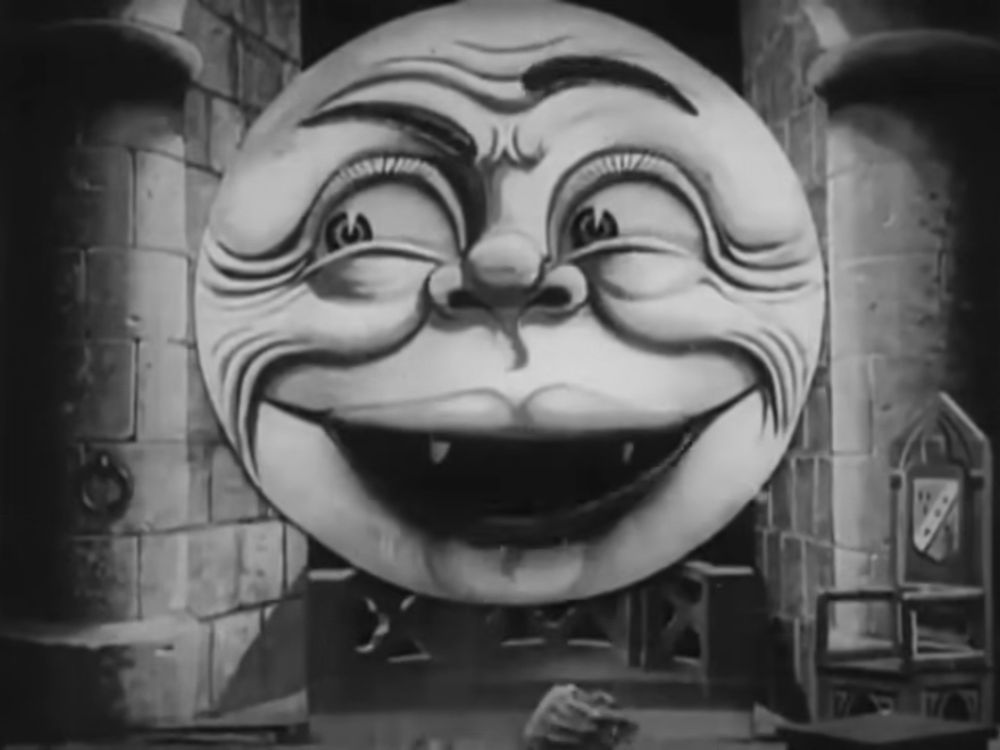 The same setting only now the moon is inside the room, hovering. It has large eyes and arched eyebrows, and a mouth open in a bloody sort of grin. In front of it, on the floor, is part of the remains of the astronomer it has just eaten and spat out.