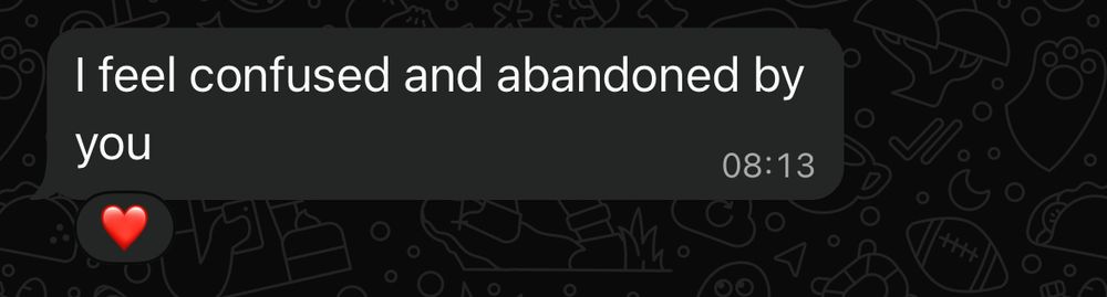 whatsapp message with heart-reaction: i feel confused and abandoned by you.