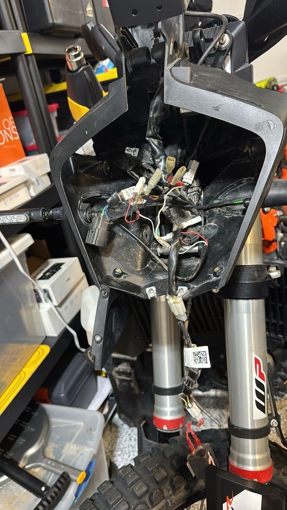 internal empty shell, full of miscellaneous wires of a front headlamp of a motorcycle
