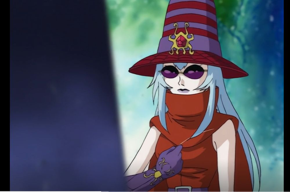An adult woman from the anime Digimon Adventure 02, standing in front of a dark structure she wears a red cape with a turtleneck flair and a sleeveles shirt of the same color clasped by a purple belt around the waist, along with a conical hat wit red and purple horizontal stripes and a brim with a spiderweb pattern crested by a red jewel on a gold spider shaped pin, she also wears purple gloves with the same spider themed patterns and crest and a pair of dark purple shades, her lips are painted the same color as well. She has long straight silver colored hair of wich she's plucking a strand with her right hand