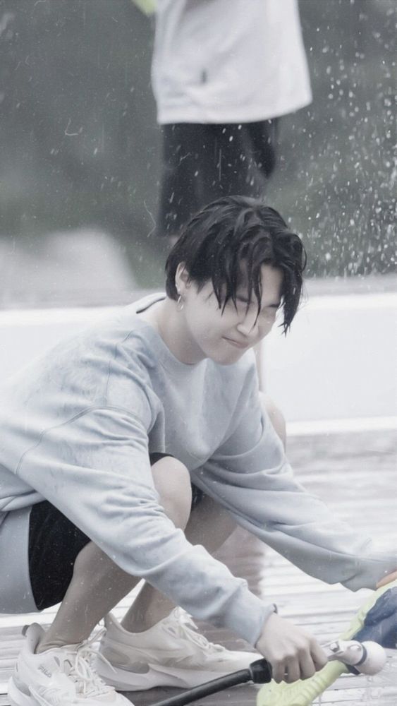Jimin getting wet in the rain