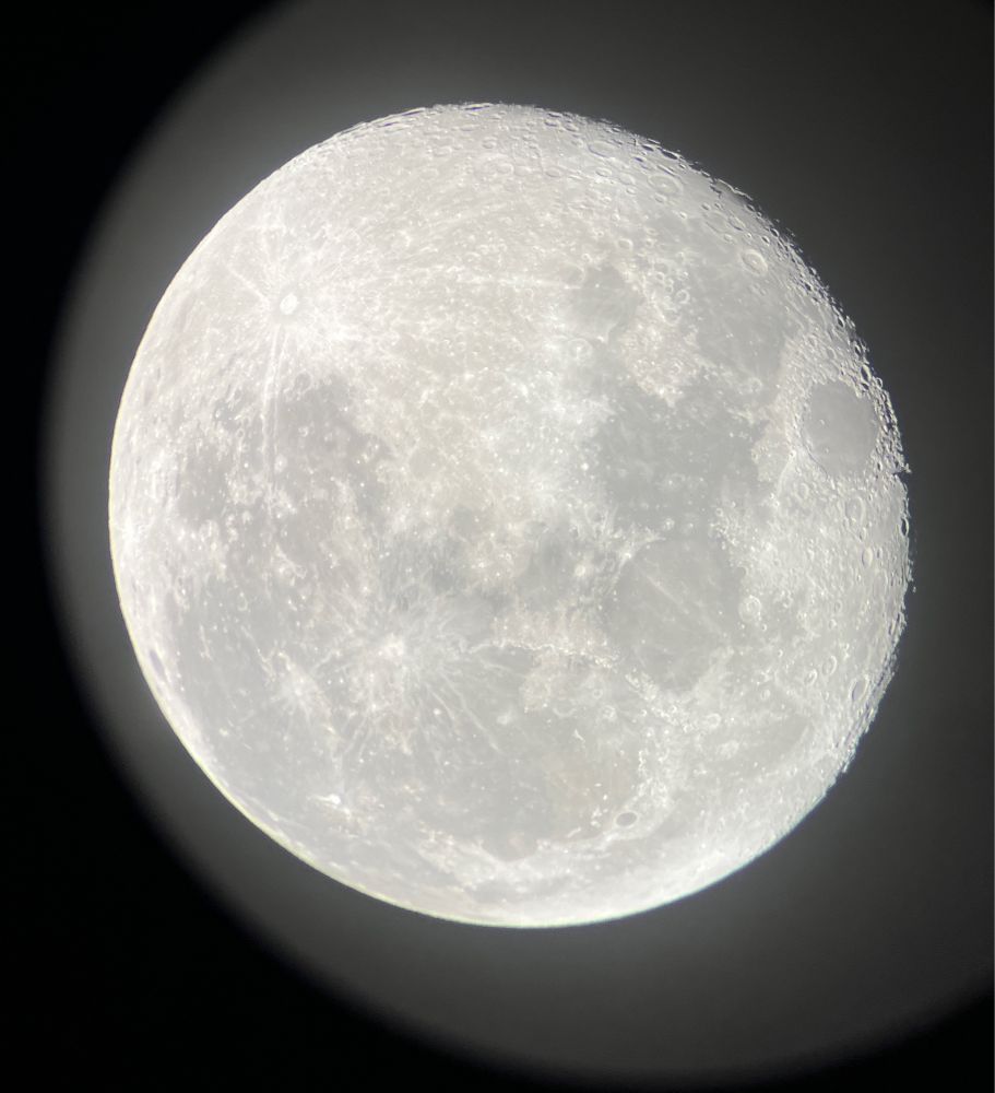 Picture of a full moon through a telescope
