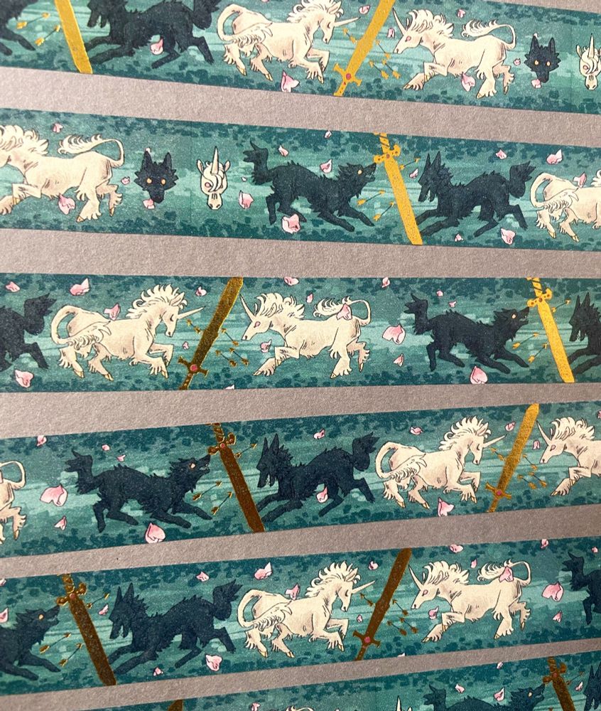 Washi tape decorated with black wolves, white unicorns and gold swords.