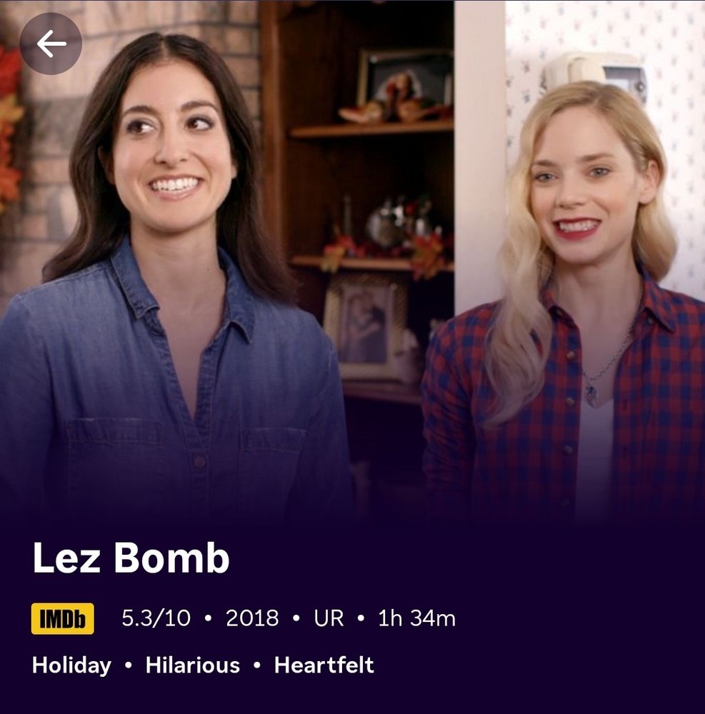 image from imdb for the movie "lez bomb" 

a white woman with dark hair & a blue shirt is next to a white woman with blonde hair and a red plaid shirt