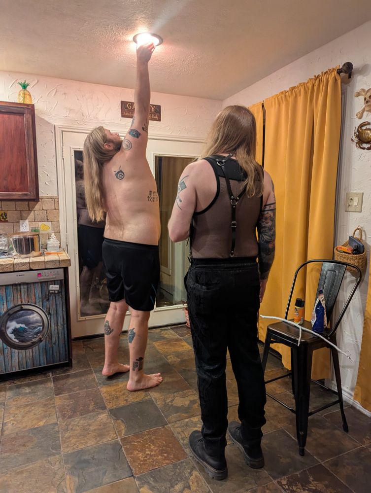 Op's bf and fiancé changing a lightbulb in the kitchen 