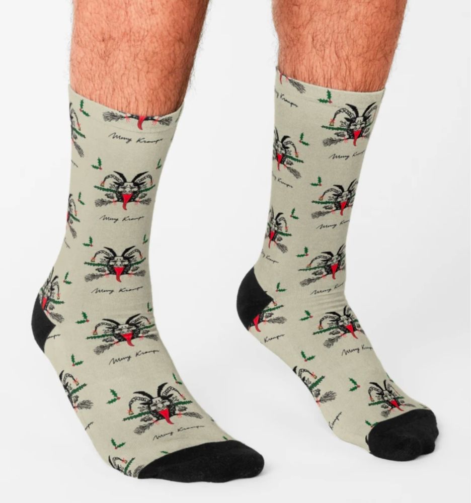 A pair of Krampus print socks with a black toe and heel