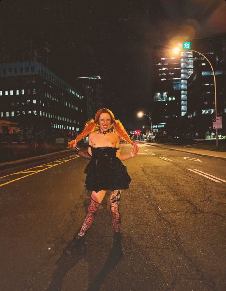 Heidi is out on the streets at night, she is wearing a black Lolita dress that she pulled down to show you her perky tits, spiderweb stockings and heavy boots. She is pulling on her Hair that she is wearing in cute pigtails, giving her a naughty look. The only thing that shines brighter than the city lights behind her is her mischievous smile.