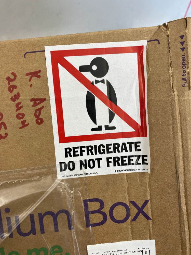 A label on a shipment box; the picture is of a crossed out penguin wearing a bow tie, the bottom text says REFRIGERATE DO NOT FREEZE. warning sign c/o my bestie at UIUC :)