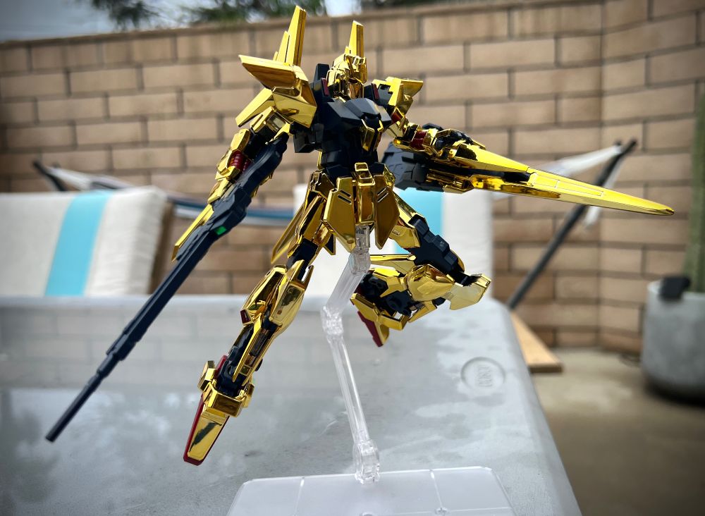 The HG 1/144 model kit of the Delta Gundam, a pointy, gold-plated mobile suit that is sort of the evolutionary predecessor to both the Zeta Gundam and the Hyaku Shiki