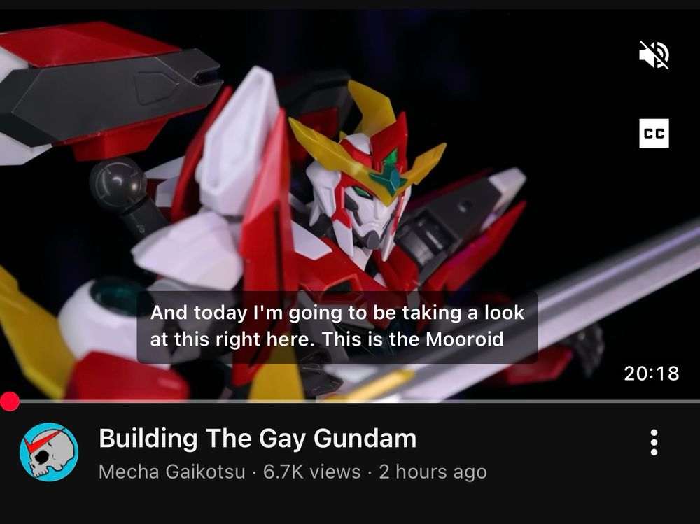 A YouTube screenshot showing a video by Mecha Gaikotsu entitled “Building the Gay Gundam”