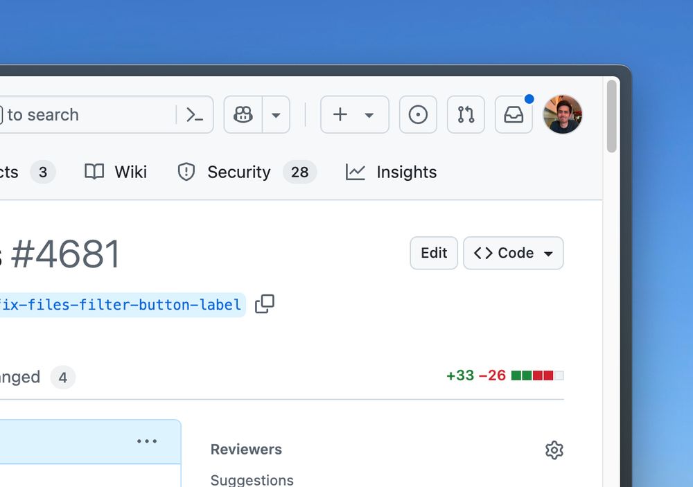 screenshot of github's ui, there is a small round blue circle on the notifications button to signal there are unread notifications