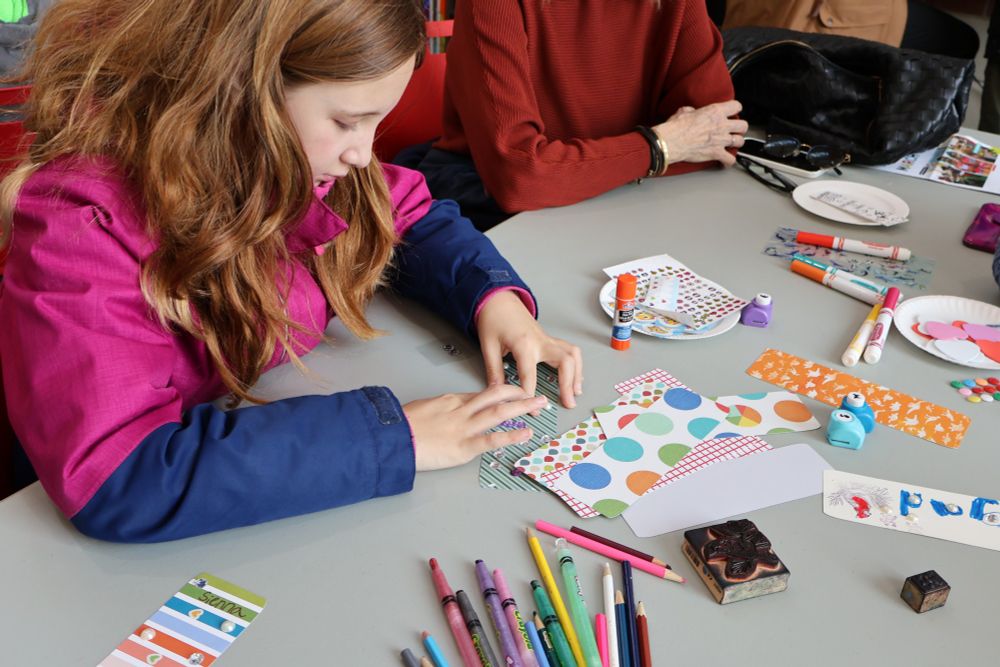 A child making a bookmark in Creative Spaces. 