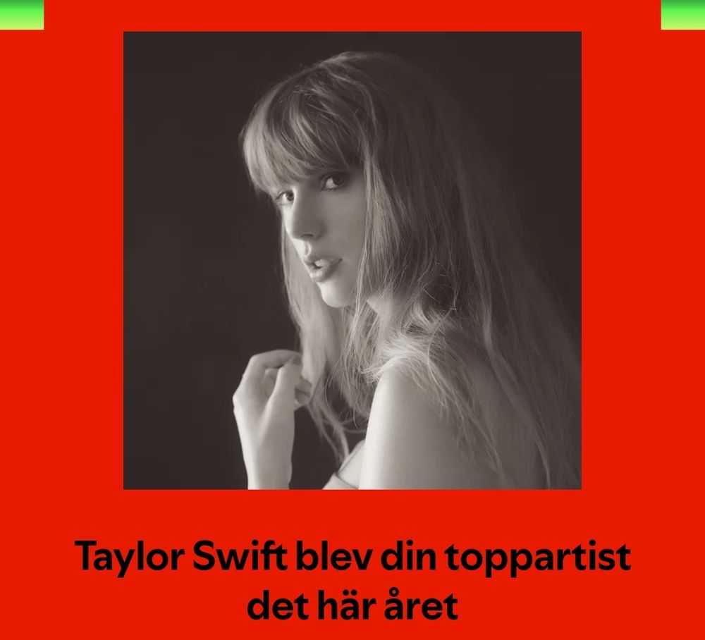 The image features a black-and-white portrait of Taylor Swift, a famous musician, with long hair and a contemplative expression, looking over her shoulder. The background is dark, creating a striking contrast with her light features. Below the image, in bold black text against a red background, it reads: "Taylor Swift became your top artist this year."

