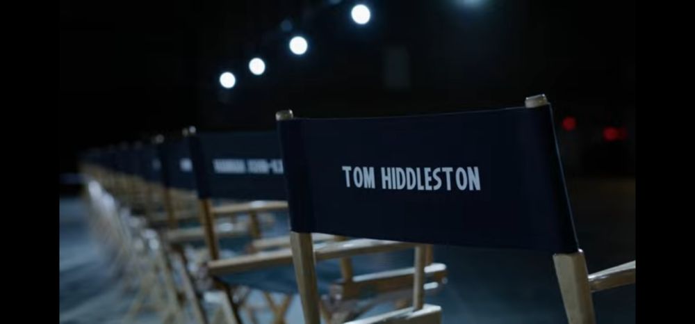 Black directors chair that says Tom Hiddleston on the back