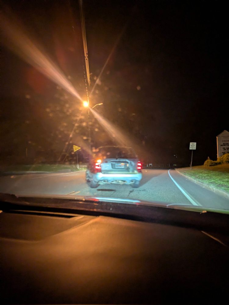 Blurry photo my boyfriend tried taking of a license plate that said "GOONER"