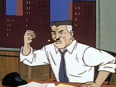 J Jonah Jameson raising a first from behind his desk.