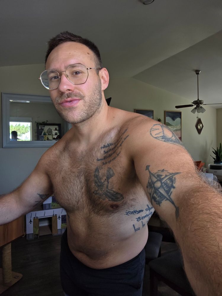 Jaws shirtless with arms outstretched 
